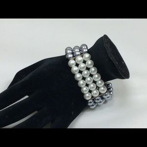 Costume Bracelet with I grey and white pearls.